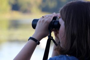 Field Ornithology Course participant with binoculars