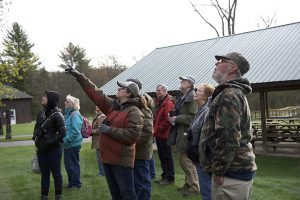 Field ornithology students look at birds together