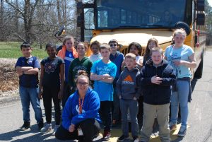 2018 Bus Scholarship group in front of school bus