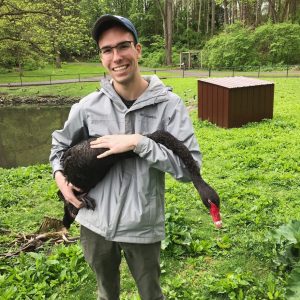 Adam Petrucco holding Black Swan