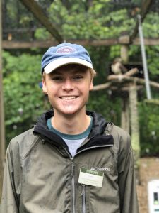 Blake Hedges with Red-Tailed Hawk in background