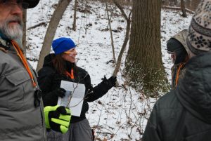 Dr. Danielle Zoellner leading a winter tree ID hike