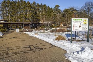 Image of the main entrance of the W.K. Kellogg Bird Sanctuary on a snowy day 