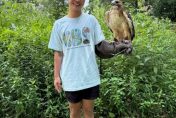 Eileen Chen holding Red Tailed Hawk on glove